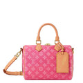 Pink handbag with tan handles and strap 